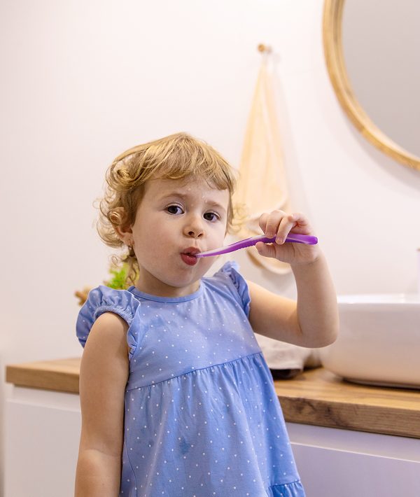 child-brushes-his-teeth-bathroom-selective-focus 1 child-brushes-his-teeth-bathroom-selective-focus 1