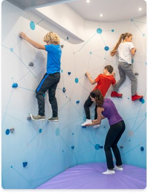 children-climbing-special-wall-woman-helping children-climbing-special-wall-woman-helping